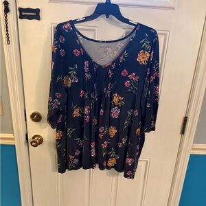 Woman Within Floral Blouse with Multicolor Blooms